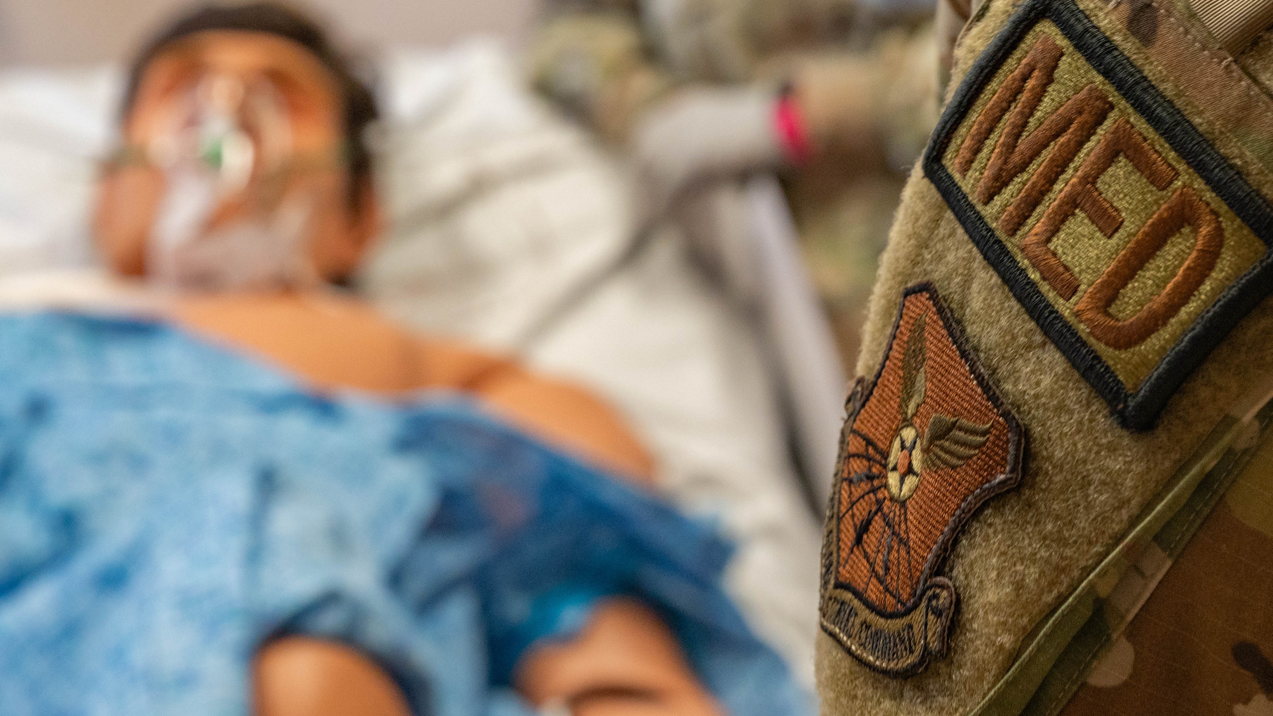 Medical personnel attend to a patient in the hospital