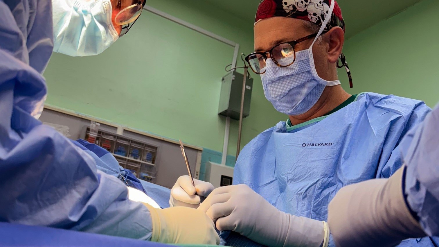 Surgeons work on patient