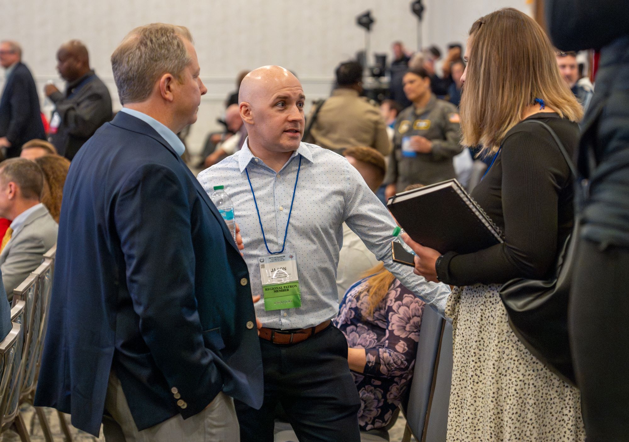 vendors speak with staff at a conference