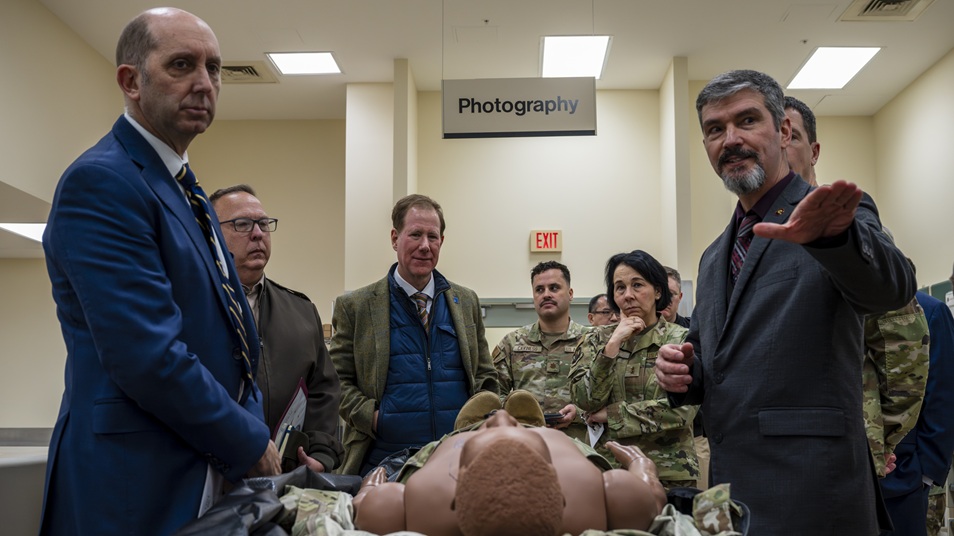 Dr. Edward Mazuchowski (right), Armed Forces Medical Examiner System deputy medical examiner, briefs Dr. Stephen Ferrara (left), Acting Assistant Secretary of War for Health Affairs, on the unique mission of the Forensic Pathology Investigations section of the AFMES on Dover Air Force Base, Delaware, Dec. 12, 2025.