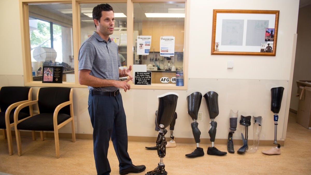 Man showing prosthetic leg options.