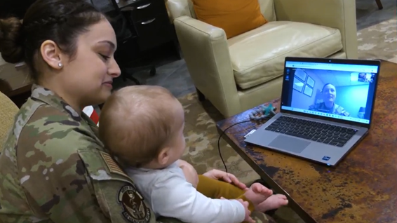 Soldier and child speak on webcam
