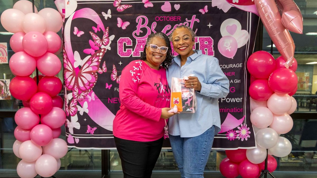 Photo By Roan Smith | A patient who received a mammogram poses with Adrienne Cobb, health educator of the General Internal Medicine Services (GIMS), during a GIMS National Mammography Day event at Walter Reed National Military Medical Center, October 16, 2026. The event promoted breast cancer awareness and encouraged eligible patients to stay current on preventive screenings.