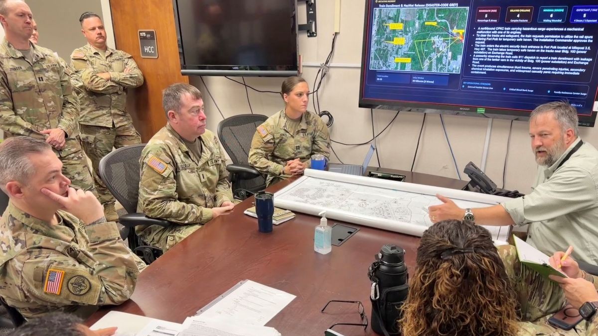 Photo By Jean Graves | Dennis O’Reilly, right, chief of operations for the Plans and Operations Division within Fort Polk’s Directorate of Plans, Training, Mobilization and Security, discusses emergency response coordination with Bayne-Jones Army Community Hospital personnel during a mass casualty tabletop discussion Oct. 15, 2026, at Fort Polk, Louisiana. Participants reviewed lessons from a May exercise and discussed communication, patient movement and accountability across hospital and installation response teams.