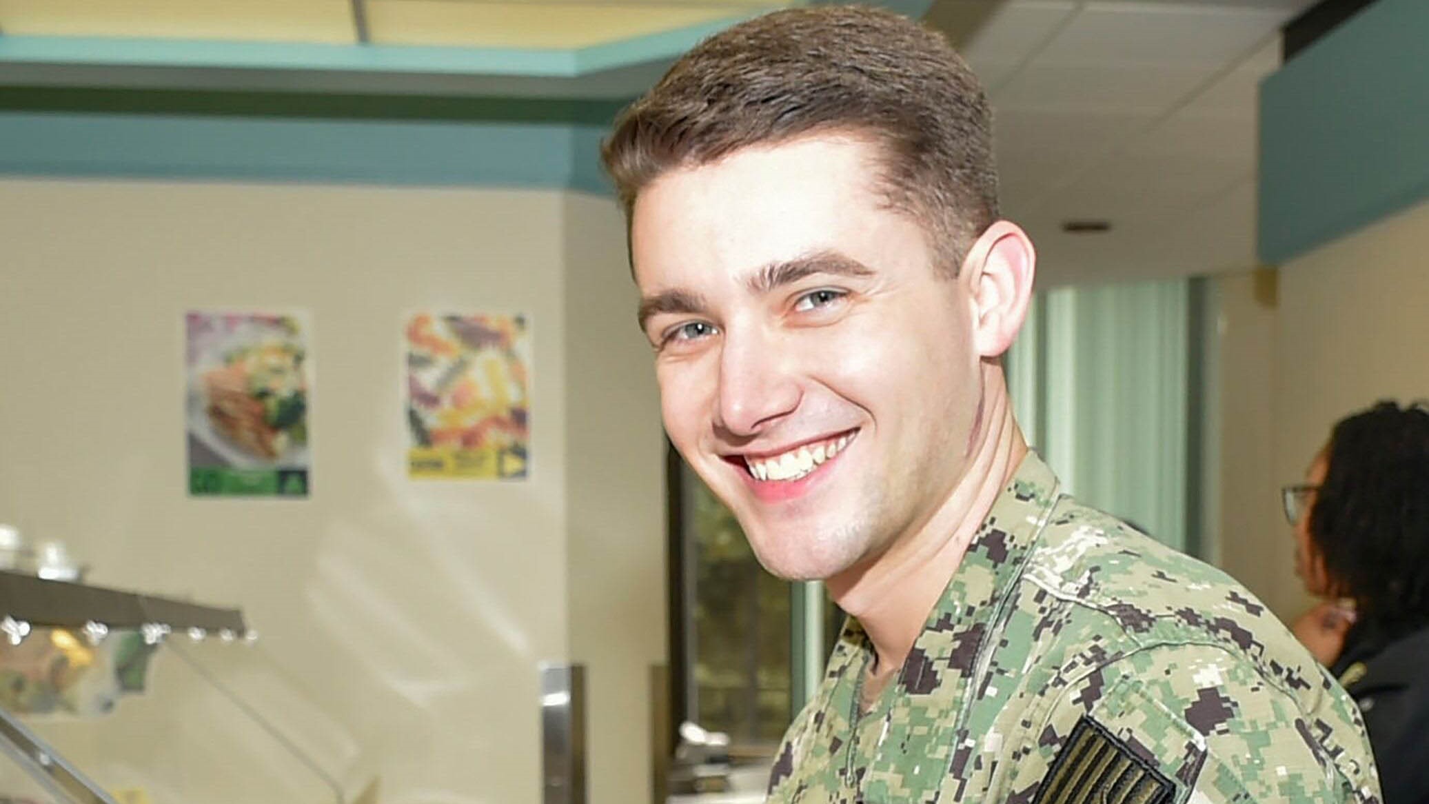 Navy Petty Officer 2nd Class Cade Crenshaw, a behavioral health technician at Naval Hospital Bremerton in Washington, smiles for a photo, May 21, 2024.
