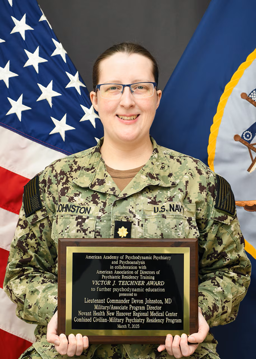 Lt. Cmdr. Devon Johnston, Military Program Director for NMCCL’s Combined Military-Civilian Psychiatry Residency Program poses with the Victor J. Teichnor plaque. The Victor J. Teichner Award, awarded by the American Academy of Psychodynamic Psychiatry and Psychoanalysis (AAPPP), provides resources to psychiatry programs teaching psychodynamic principles and psychodynamic psychotherapy where there is a lack of local assets to assist in psychodynamic education.
