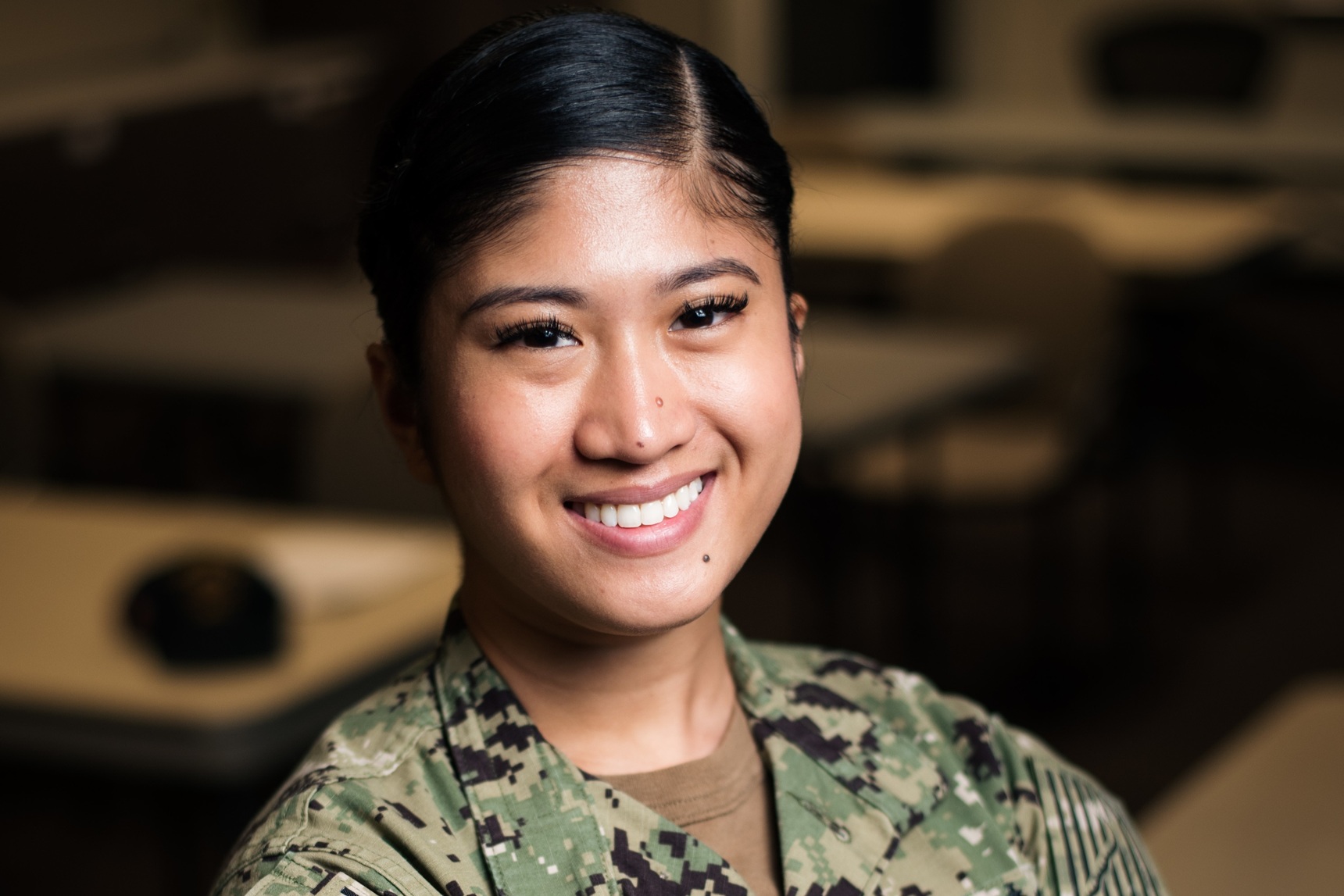 Seaman Jenel Usi, from San Francisco, poses for a photo during a Navy Personnel Command (NPC) Fleet Engagement Team event onboard Commander, Fleet Activities Sasebo.