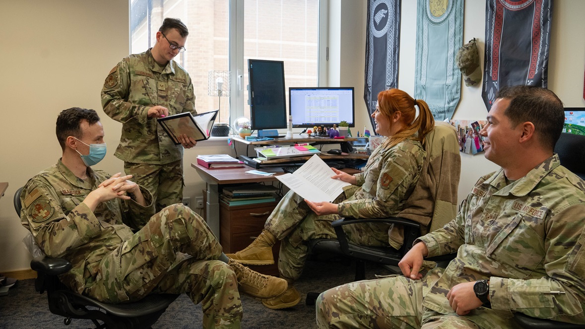 Liberty Wing Airmen from the Alcohol and Drug Abuse Prevention and Treatment program, or ADAPT, discuss up to date information regarding patients, training and case staffing at Royal Air Force Lakenheath, England, March 23, 2023. The program aims to promote readiness, health and wellness through the prevention and treatment of substance misuse and abuse. (U.S. Air Force photo by Airman 1st Class Austin Salazar)