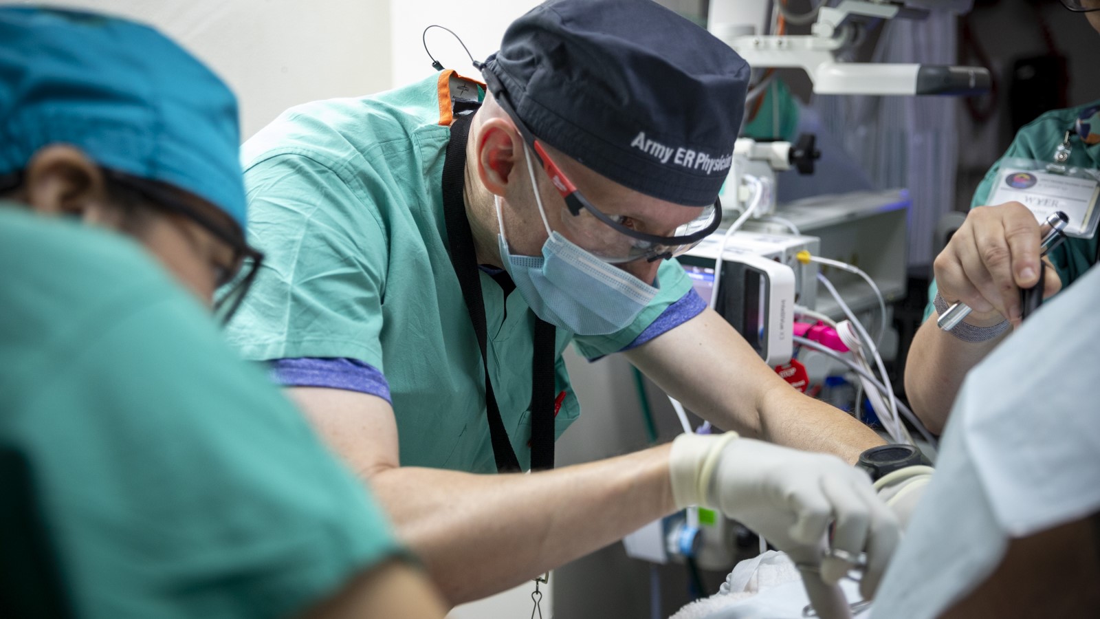 Photo By Ronald Bell | U.S. Army Reserve Lt. Col. Donald Keen, Emergency Physician from the 909th Forward Surgical Resuscitative Detachment, sutures a laceration at Ryder Trauma Center in Miami, Fla., on Aug. 12, 2023. The training helps the team know their role while treating a patient. (U.S. Army Reserve Photo by Spc. Ronald D. Bell)