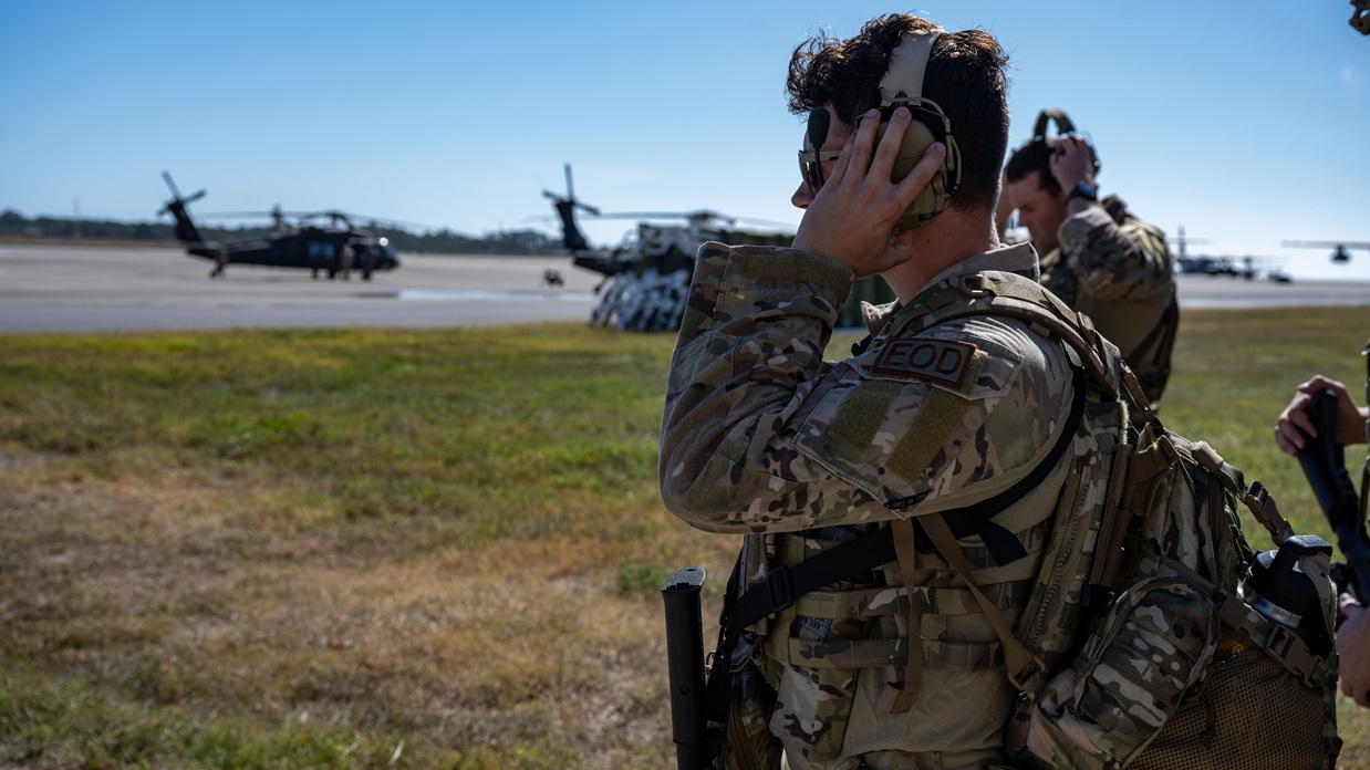 A U.S. Airman, assigned to the 1st Special Operations Civil Engineer Squadron explosive ordnance disposal team, puts on hearing protection before boarding an MC-130J Commando II during a bivouac exercise at Hurlburt Field, Florida, Nov. 4. The exercise tested the 1st Special Operations Missions Support Group’s ability to rapidly deploy and establish base operations infrastructure enabling contingency and wartime operations. (U.S. Air Force photo by Senior Airman Hussein Enaya)