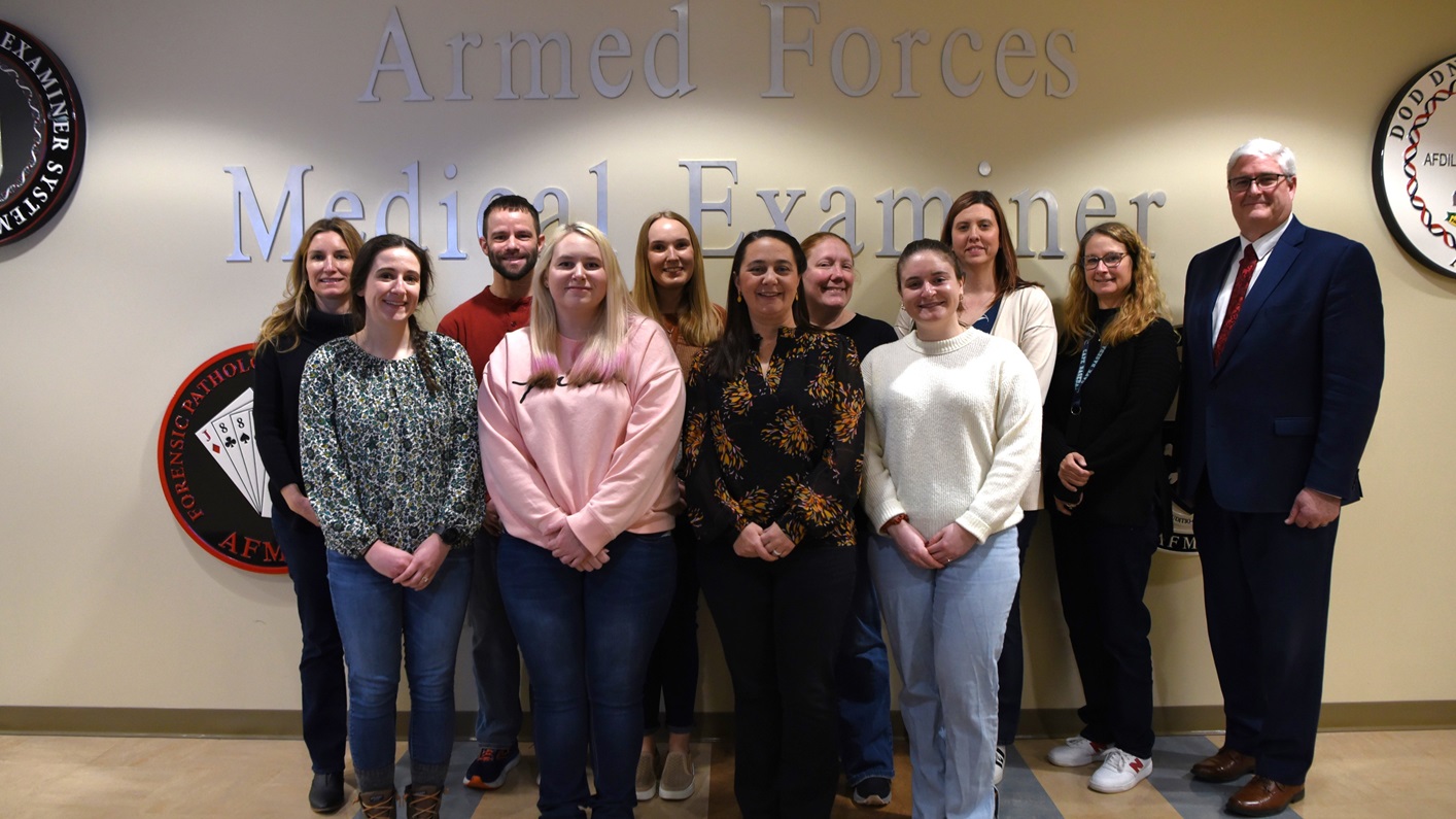 Staff from the Armed Forces DNA Identification Laboratory (AFDIL) that were instrumental in the development and validation of the Single Nucleotide Polymorphism (SNP) capture gather for a group picture at the Armed Forces Medical Examiner System, Dover Air Force Base, Delaware, February 13, 2025. SNP capture builds upon the mitochondrial genome (mtG) Next-Generation Sequencing (NGS) and hybridization capture methods validated in 2016. In 2015, knowing that traditional nuclear short tandem repeat methods would not work on samples requiring mtG NGS methods, AFDIL worked with the Department of Defense Small Business Innovation Research program and Defense Rapid Innovation group, and submitted a public proposal. (U.S. Air Force photo by Staff Sgt. Deven Schultz)