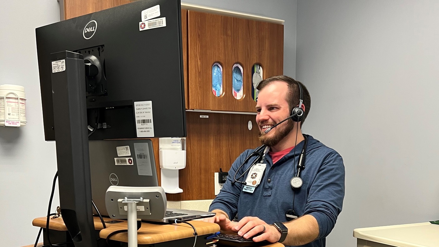 Family Nurse Practitioner, Steven Jernigan, Hope Mills Medical Home conducting a virtual appointment with a patient. Womack Army Medical Center primary care and outlying clinics implemented My Military Health in December, enhancing patient flexibility for better health management.