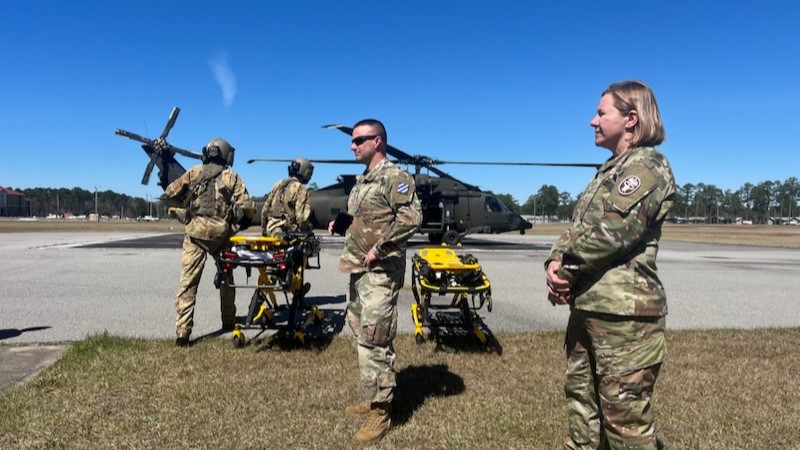 Col. Margaret Berryman, Fort Stewart U.S. Army Medical Department Activity commander and Winn Army Community Hospital director, looks on as simulated injured patients from 2nd Armored Brigade Combat Team are transferred