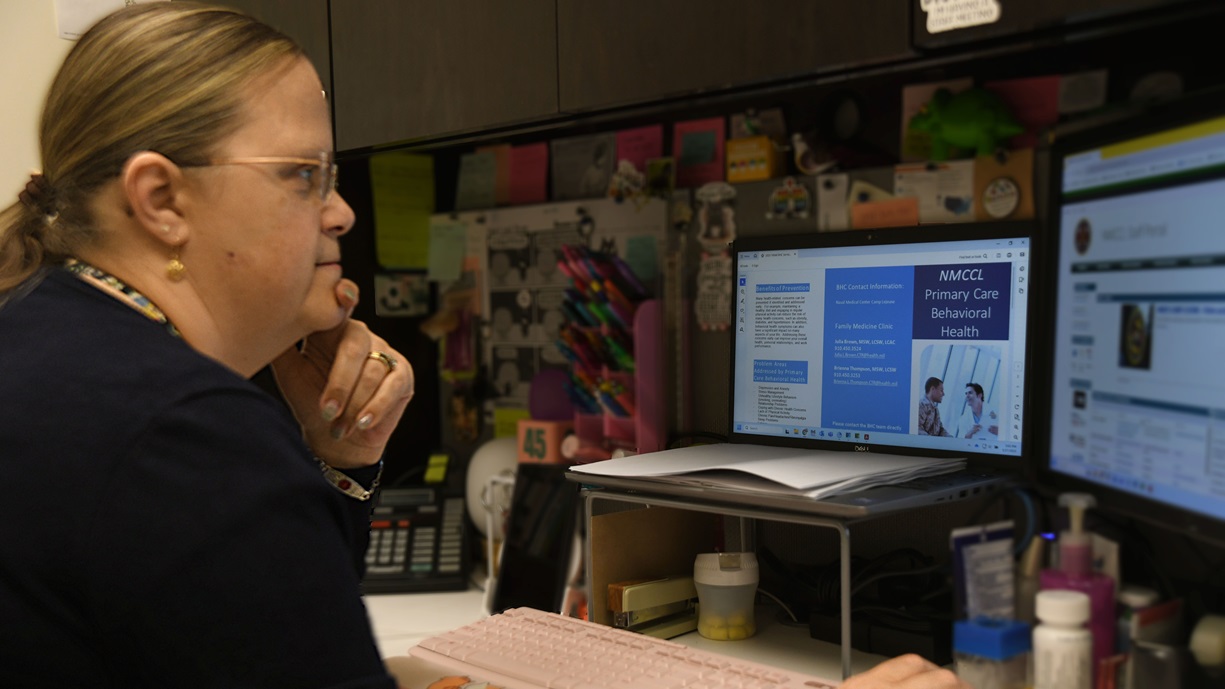 Julia Brown, a Naval Medical Center Camp Lejeune (NMMCL) behavioral health consultant (BHC), reviews educational materials for BHC-referred patients. BHCs perform brief, focused assessment and interventions with patients suffering from a range of conditions and assists the patient in making behavioral changes that optimize their health. NMCCL has provided more than 80 years of dedicated, passionate care for warfighters and beneficiaries at Marine Corps Base Camp Lejeune.