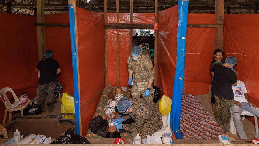 Philippine and U.S. service members provide dental care to locals during Exercise Balikatan 25 at the Manggahan village center in Barangay Iraan, Rizal, Palawan, Philippines, April 14, 2025. Balikatan is a longstanding annual exercise between the Armed Forces of the Philippines and the U.S. military designed to strengthen our ironclad alliance, improve our capable combined force and demonstrate our commitment to regional peace and prosperity. (U.S. Marine Corps photo by Lance Cpl. Roger- Junior Annoh)