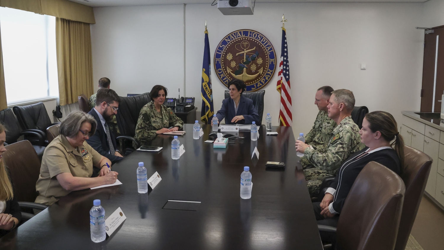 Susan Orsega, center, deputy assistant secretary of defense for health services policy and oversight, meets with U.S. Naval Hospital Okinawa Director Capt. Kathleen Cooperman, left of center, and hospital leadership during a visit to the facility April 9, 2025. (U.S. Navy photo by Mass Communication Specialist 1st Class Trey Fowler)