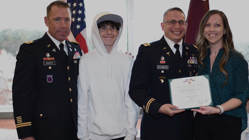 Col. Matthew Mapes, the Evans Army Community Hospital commander, far left, poses with Maj. Josha Goldberg, the Department of Education chief at EACH, his wife, Kaylanda Pinkerton, the chief nurse for the Mountain Post Birthing Center, and their son, Ryder, during Goldberg's Soldiers Medal ceremony, April 18, 2025. Goldberg was awarded the Soldier’s Medal for his actions during a community sporting event in 2024.