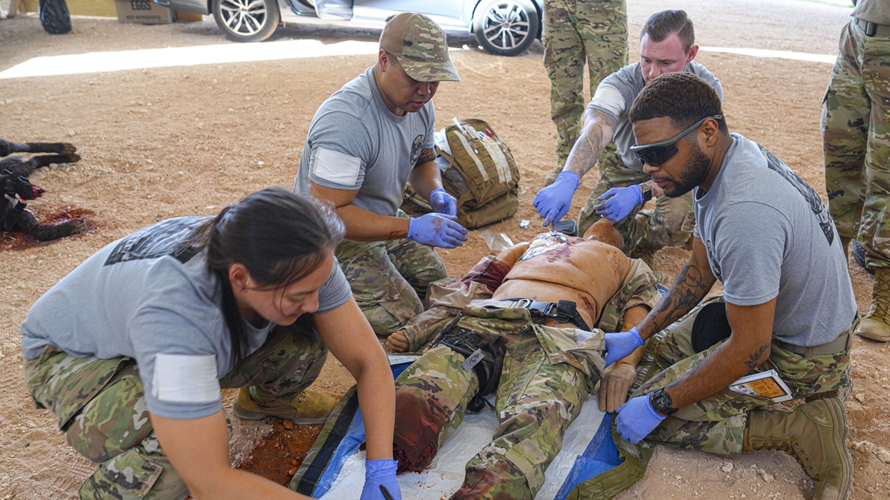 U.S. Air Force medics treat a simulated patient during the 16th Annual Medic Rodeo exercise at Cannon Air Force Base, New Mexico, May 14, 2025. The rodeo challenged medical personnel with realistic scenarios to enhance readiness, responsiveness, and life-saving capabilities. (U.S. Air Force photo by Airman 1st Class Gracelyn Hess)