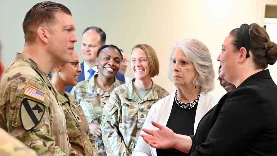 Col. Patrick W. Miller, commander of Bayne-Jones Army Community Hospital, speaks with Whitney Albright and Donna Howe, field representatives for U.S. House Speaker Mike Johnson, R-La., during the reception following the BJACH change of command ceremony June 11 at the Joint Readiness Training Center and Fort Johnson, Louisiana.