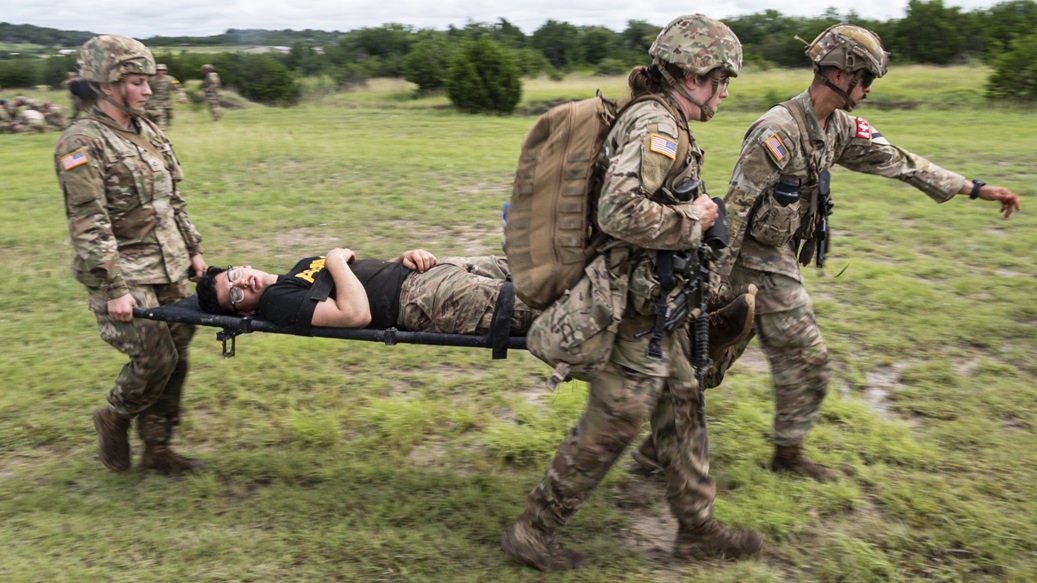 Participants in the Joint Emergency Medicine Exercise (JEMX-25) carry a simulated casualty as part of a combat casualty care training lane during the Joint Emergency Medicine Exercise (JEMX-25), Fort Cavazos, Texas, June 12, 2025.
