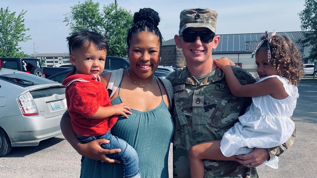 Staff Sgt. Jack Helton stands with his wife, Becca, and their children, Copelan, 2, and Haegan, 3, following his graduation from the U.S. Army recruiting school at Fort Knox, Kentucky, on June 12, 2025.