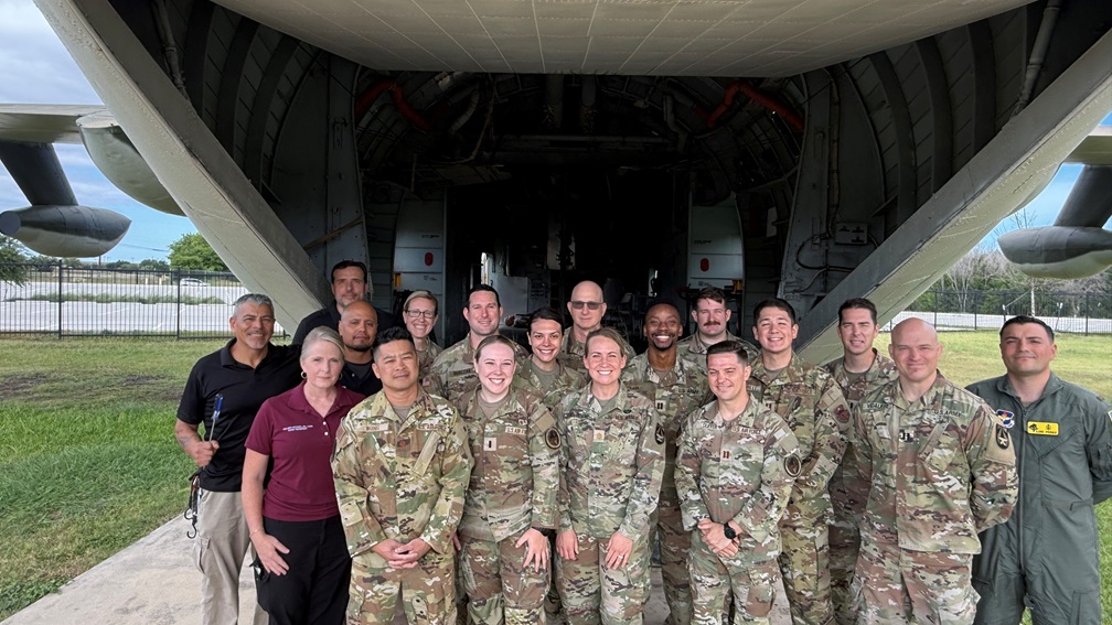 Members of the U.S. Army Institute of Surgical Research Burn Flight Team pose for a group photo with members of the U.S. Air Force’s 59th Medical Wing during a training exercise.