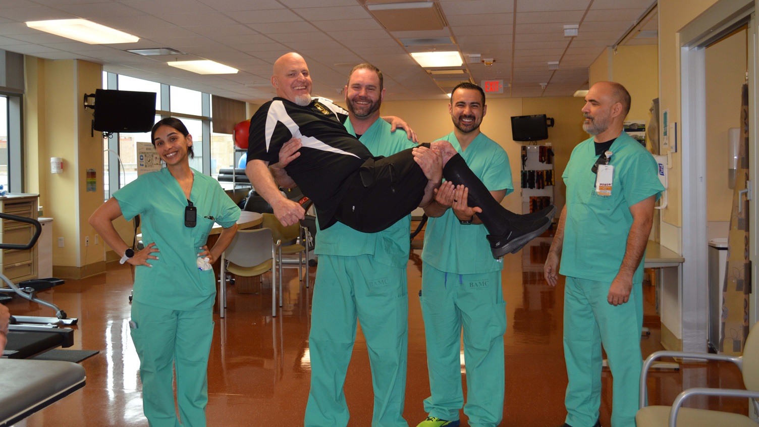 Physical Therapist Kyle Cunningham picks up burn survivor retired Army Master Sgt. Chris Hiatt