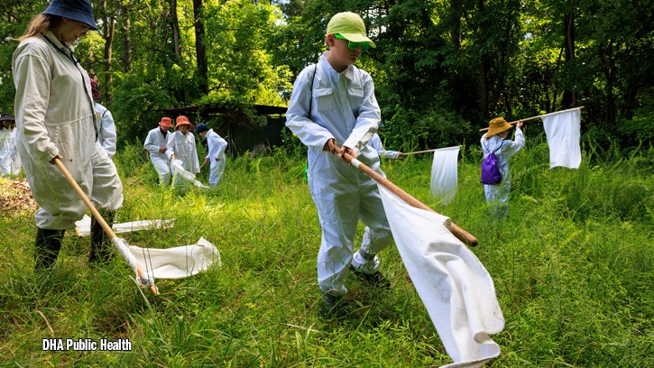 Entomologists with Defense Centers for Public Health-Aberdeen work with campers who traveled from Maryland, Virginia and New York for the inaugural Bug Camp held July 14 to 18 at Aberdeen Proving Ground, Maryland.