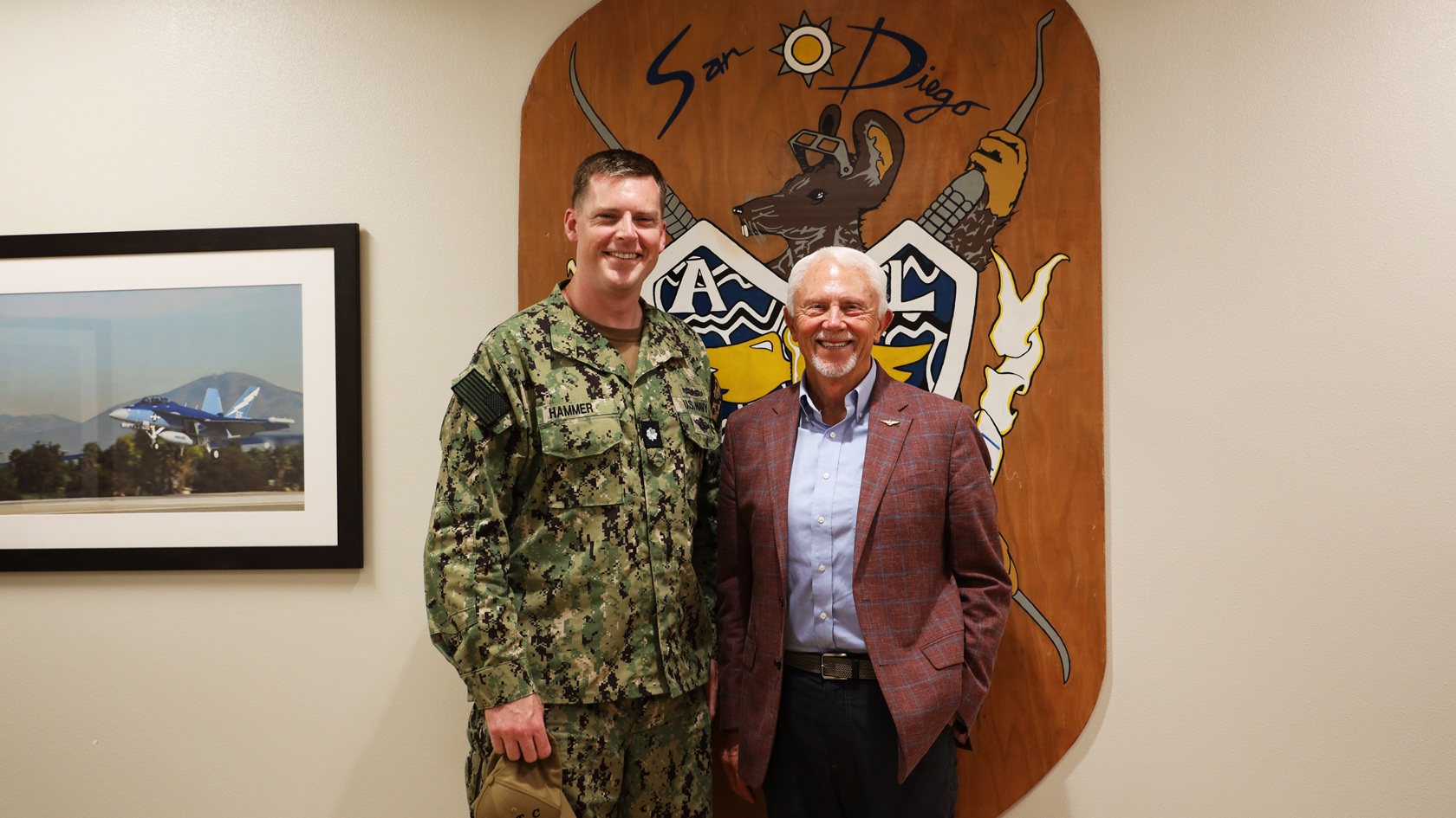 Cmdr. Daniel Hammer, oral maxillofacial surgeon, and U.S. Rep. Jack Bergman (MI-01) pose for a picture Aug. 11 during a tour of the Defense Health Agency’s regional dental laboratory. Bergman was in San Diego to visit Naval Medical Center San Diego to learn how they support readiness, health care delivery, and the Maxillofacial Restoration Program, which is led by Hammer, an innovative initiative that is transforming dental readiness and patient’s lives. (DOD photo by Regena Kowitz)
