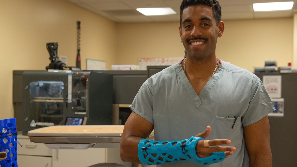 U.S. Navy Hospital Corpsman Petty Officer Third Class Danny Berroa Figueroa models a 3D printed waterproof cast at Naval Medical Center San Diego, September 9, 2025. The technology, developed by ActivArmor, is set to be deployed across 11 military bases over 24 months. (U.S. Navy photo by Mass Communication Specialist Seaman Jason Afable)