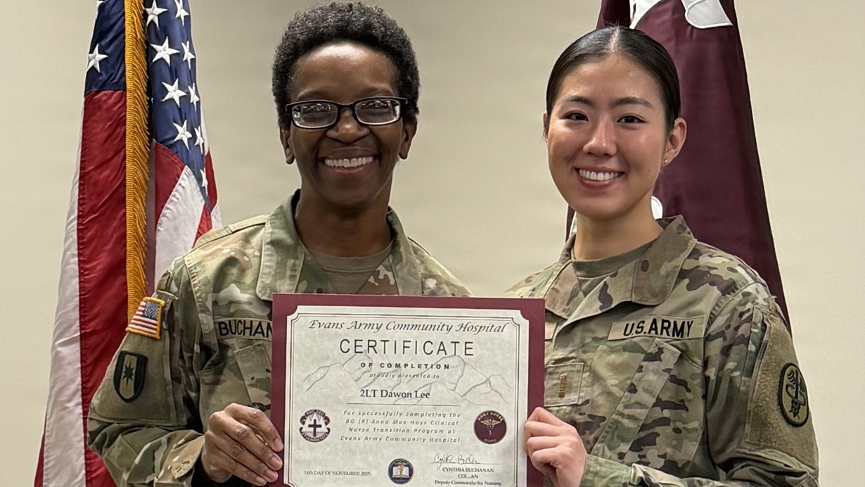 2nd Lt. Dawon Lee, an Army Nurse assigned to Evans Army Community Hospital, receives a graduation certificate from Col. Cynthia Buchanan, the EACH Deputy Commander for Nursing, during the Clinical Nurse Transition Program graduation ceremony on Friday, Nov. 14, 2025.