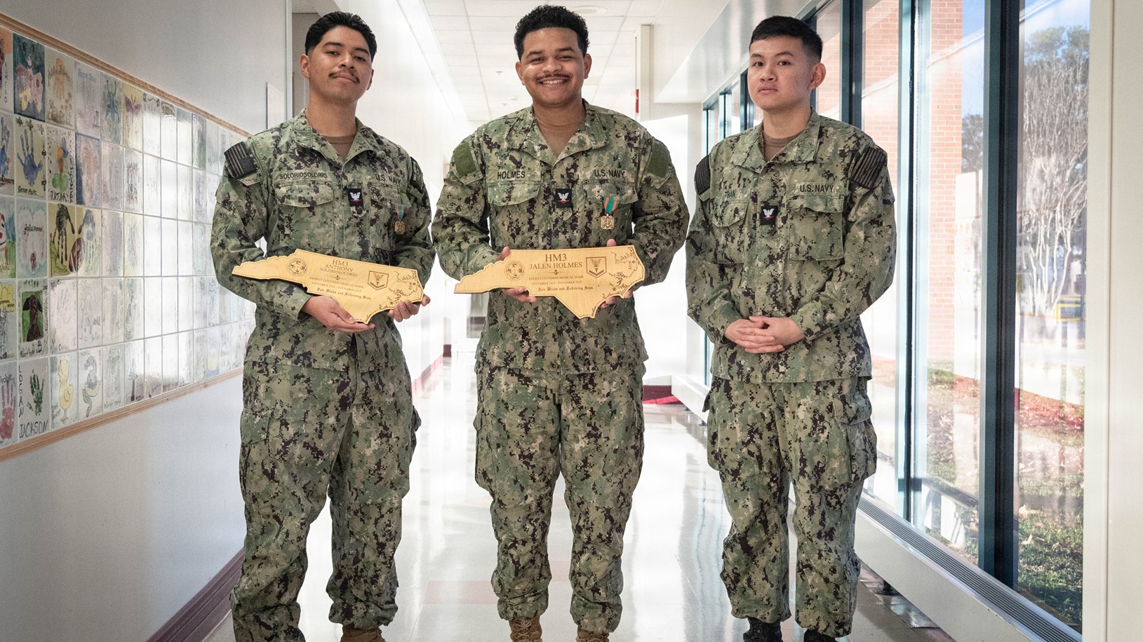 The staff of Naval Health Clinic Cherry Point gathered Monday, November 24 to celebrate the promotion of one Corpsman and honor the excellence in patient care of two others