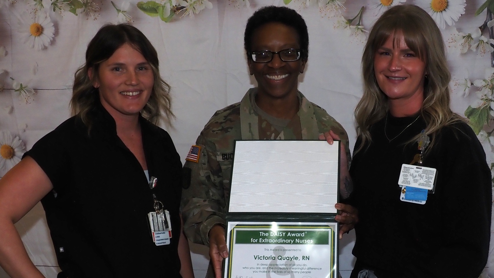 Victoria Quayle, right, a registered nurse in Evans Army Community Hospital’s Allergy Clinic, was one of three individual honorees recognized at a Daisy Award Ceremony on Friday, Nov. 21, 2025, at Evans Army Community Hospital. Col. Cynthia Buchanan, the EACH deputy commander for nursing, presented the award. Also pictured is Jessica Kelly, who nominated Quayle for the award. 