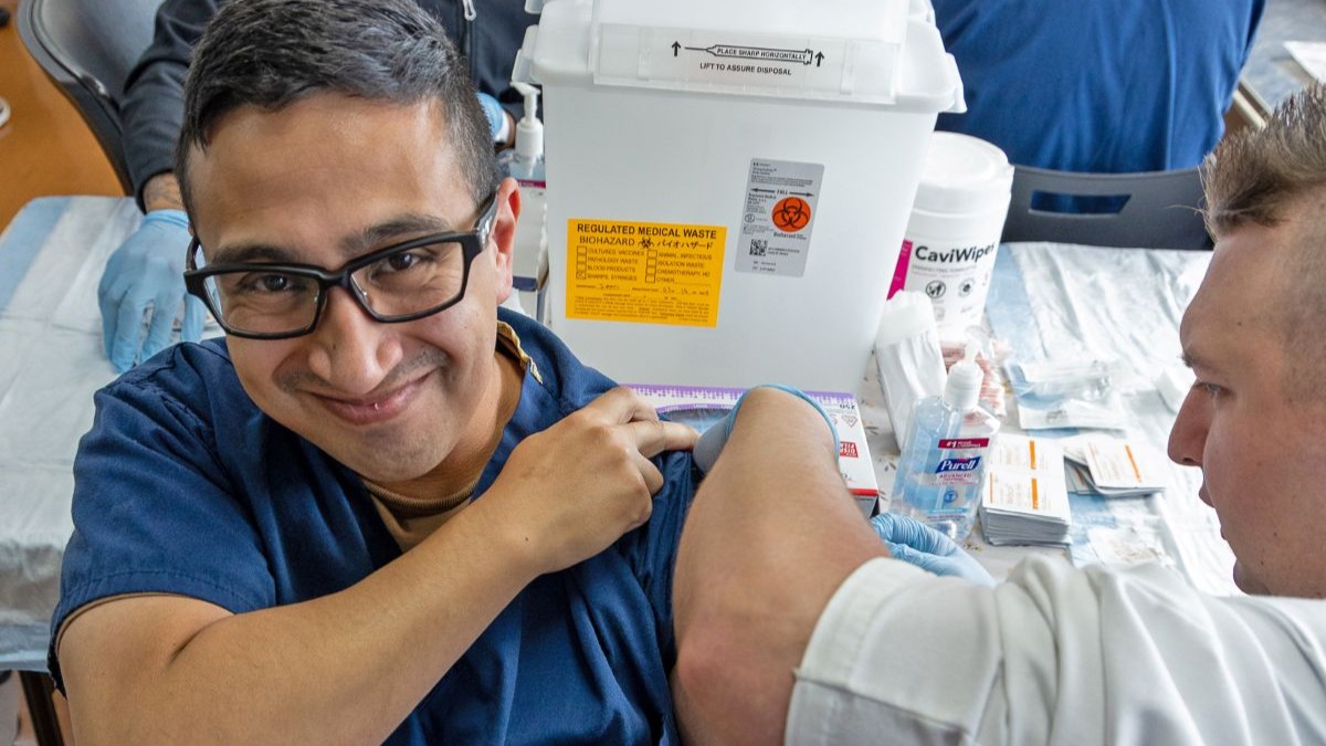 A Hospital Corpsman administers an influenza vaccine to a USNH Yokosuka staff member in the Command Auditorium during the start of the hospital’s 2025 influenza vaccination season. Over the course of the 2025 flu shot events, USNH Yokosuka’s vaccination teams administered more than 6,800 doses, efficiently protecting thousands across the installation. The hospital’s annual campaign strengthens medical readiness and protects the health of Sailors, families, and civilian staff. (U.S. Navy photo by USNMRTC Yokosuka Public Affairs/Daniel Taylor)