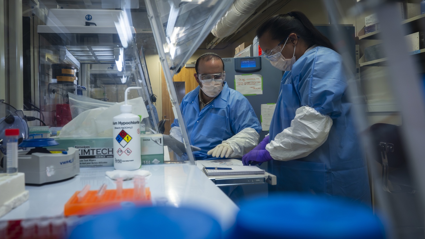 Mandalay Singleton (right), Armed Forces DNA Identification Laboratory past accounting technician, provides instruction to Reouven Berdugo (left), Israel Defense Forces Genomic Laboratory for Casualty Identification director, on the Single Nucleotide Polymorphisms (SNPs) workflow in the AFDIL of the Armed Forces Medical Examiner System at Dover Air Force Base, Delaware, Nov. 20, 2025.