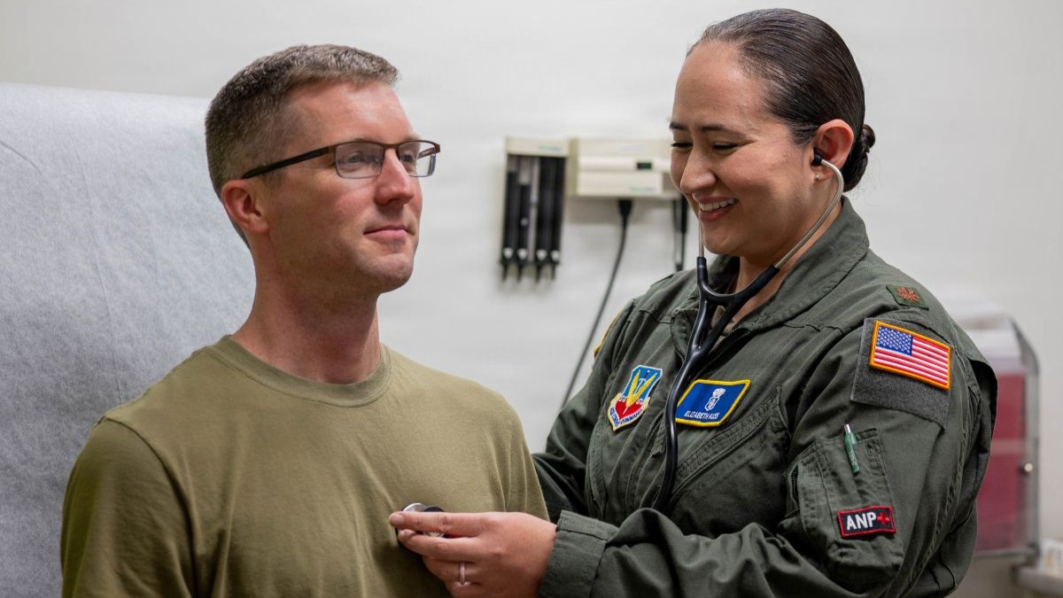 U.S. Air Force Maj. Elizabeth Kuss, 325th Operational Medical Readiness Squadron flight medicine flight commander, interacts with a patient at Tyndall Air Force Base, Florida, Dec. 17, 2025. Through patient-centered care, Kuss helps keep Airmen medically ready to perform their duties. (U.S. Air Force photo by Airman 1st Class Amanda Alvarez)