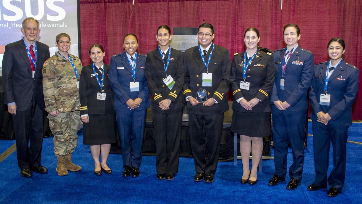 Dr. David Smith, Defense Health Agency acting deputy director, poses with military medical professionals who participated in DHA’s 5th Annual Clinical Investigations Program Young Investigator Competition at National Harbor, Maryland, March 3.