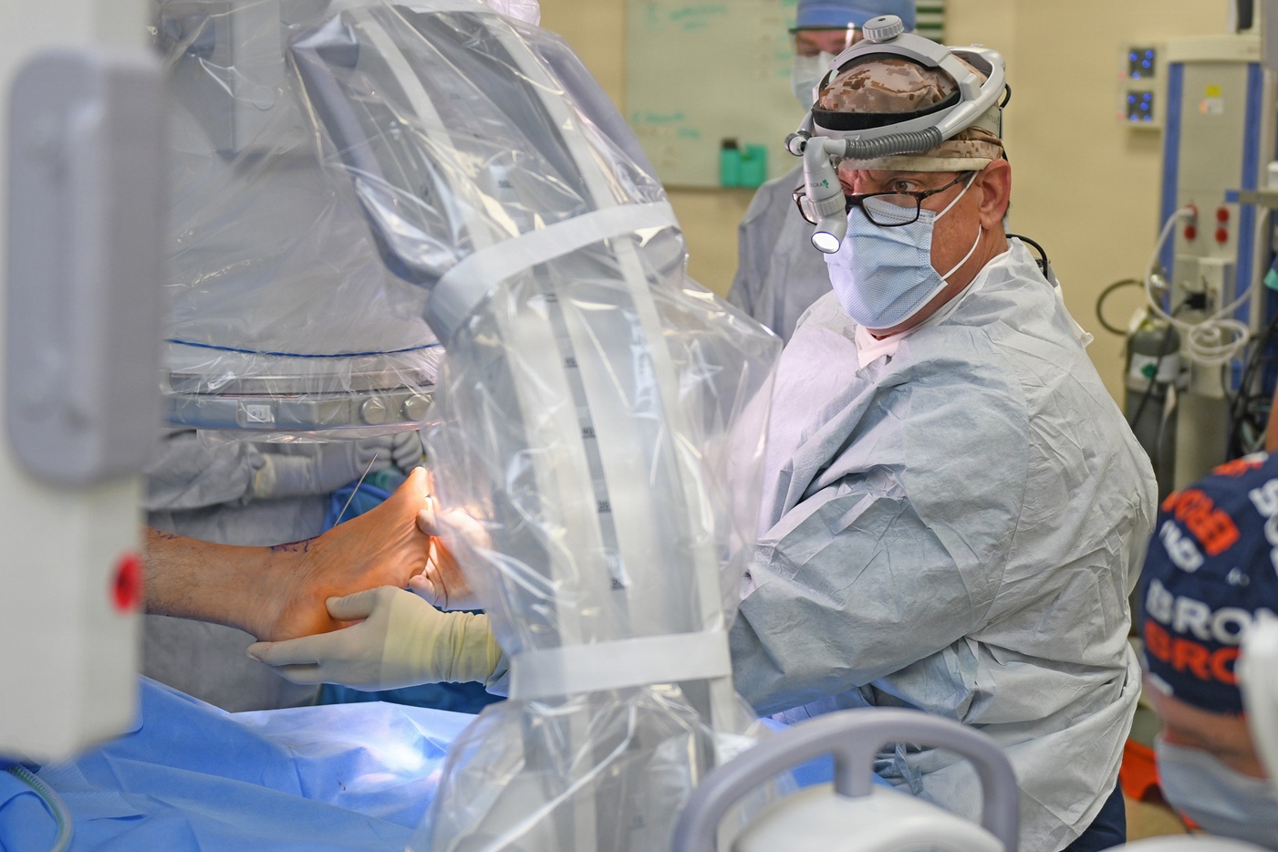 Department of Veterans Affairs (VA) Orthopedic Surgeon Mark Gould, U.S. Navy retired captain, prepares for a hindfoot fusion surgery at Naval Hospital (NH) Jacksonville