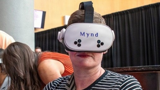 Retired Marine Corps Lt. Col. Carrie Howe tries an extended-reality headset game July 15 during a joint Veterans Health Administration and Defense Health Agency Immersive Health Care Technology Demo Day at the Washington VA Medical Center in Washington, D.C. The event provided veterans, service members, clinicians, and agency leaders with an opportunity to try technology designed to treat veterans and service members with a range of healthcare issues.