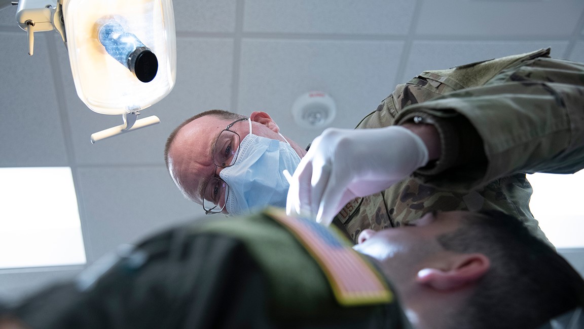 Air Force Lt. Col. Rory Fredrick, a dentist with the 134th Medical Group, Tennessee Air National Guard, performs a routine exam on a member Jan. 6, 2024, to keep members deployment-ready. Dental screenings help prevent dental emergencies from arising during critical missions, increasing the overall lethality of the force. (U.S. Air National Guard photo by Master Sgt. Nancy Goldberger)