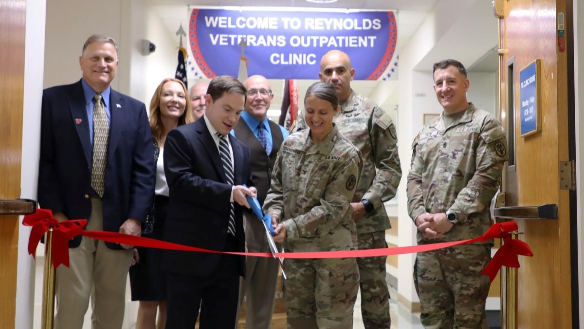 RAHC Commander Col. Nicole Charbonneau cuts the ribbon on the new VA Clinic at Reynolds Army Health Clinic with Mr. Paul Gregory Associate Director for the OKC VA Health Care system. From left to right, Dr. Kirk Eggleston assistant director medical affairs Defense Health Network, West, Ms. Rebecca Hacker, assistant director healthcare operations Defense Health Network, West, Lawton Mayor Stan Booker, Dr. Alvin Peterson Deputy to the Commanding General United States Army Fires Center of Excellence and Fort Sill, Command Sgt. Maj. Robert Flynn Command Sergeant Major United States Army Fires Center of Excellence and Fort Sill, Command Sgt. Maj. Michael Tatu Command Sergeant Major Reynolds Army Health Clinic.