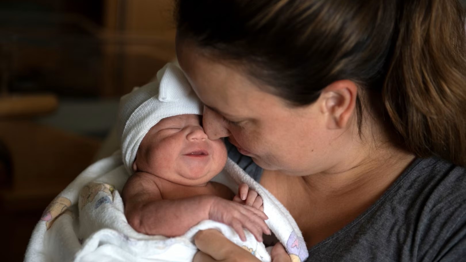 Mom holding newborn baby