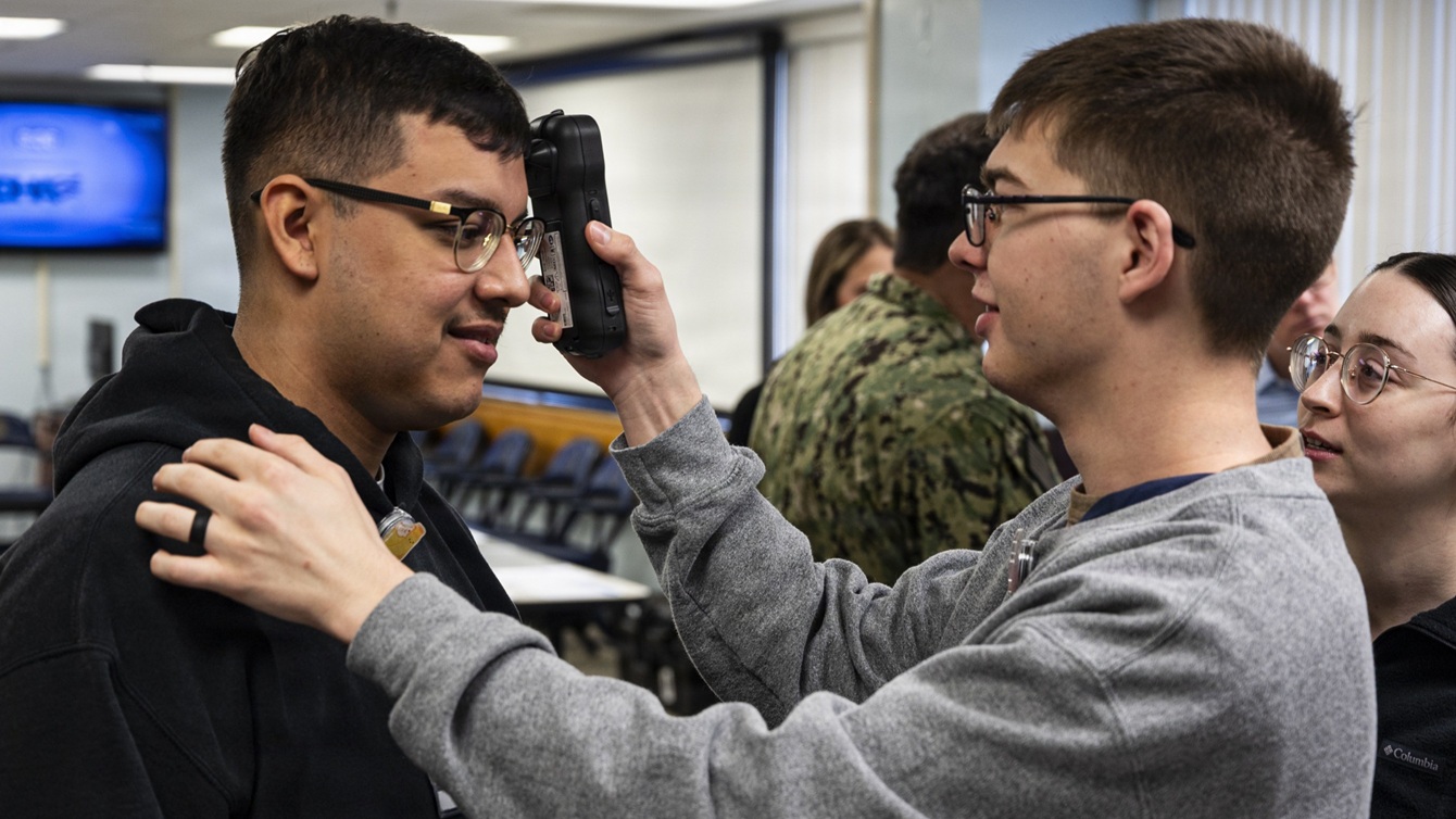 Hospital Corpsman Xander Jacobson, right, operates a near infrared Traumatic Brain Injury assessment device during an end-user touchpoint hosted by the Operational Medical Systems Program Management Office, Camp Lejeune, North Carolina, Jan. 14, 2026. 