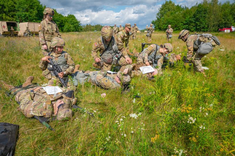 Soldiers tending to the wounded out in the field