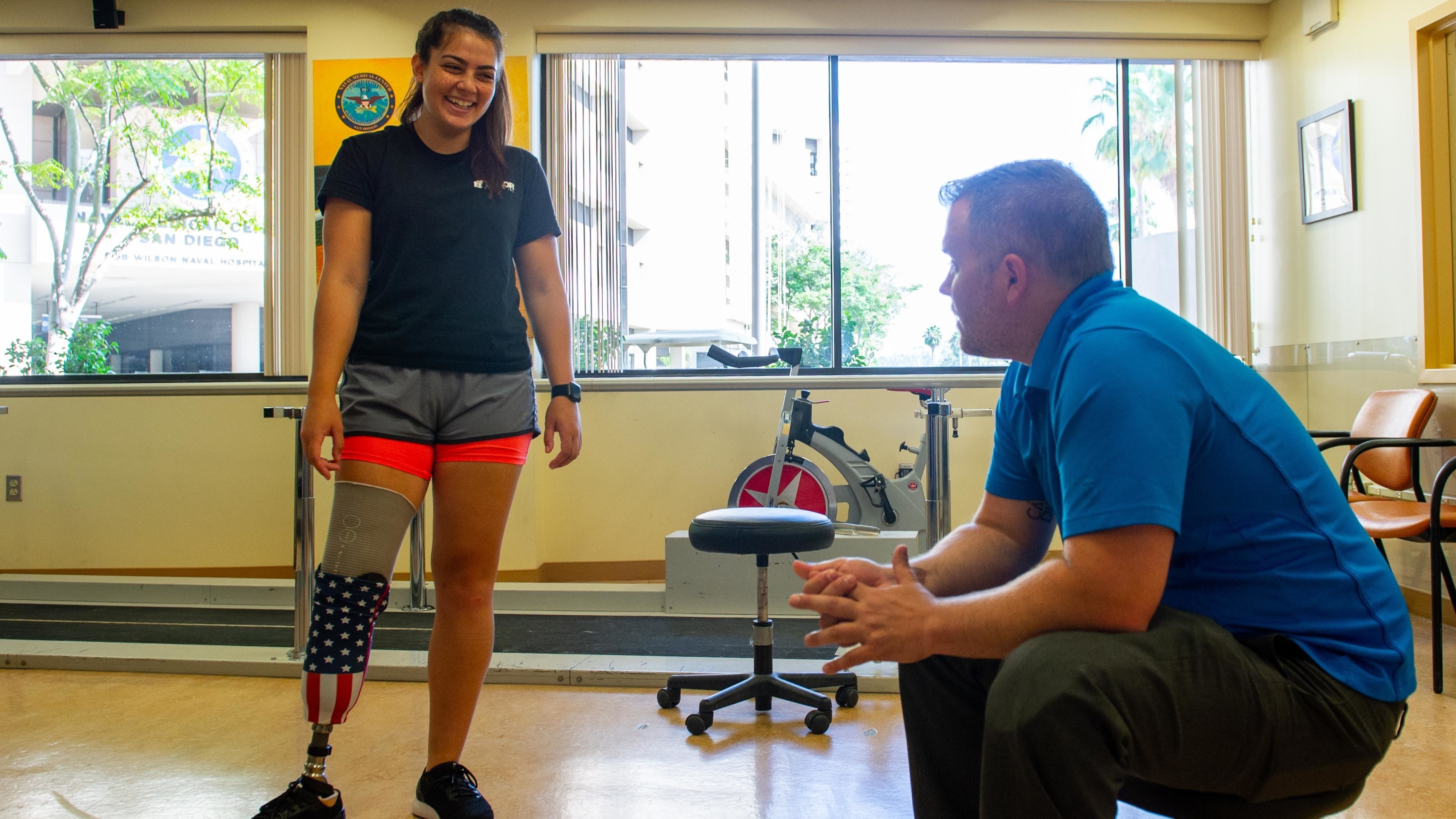 Amputee chatting with physio